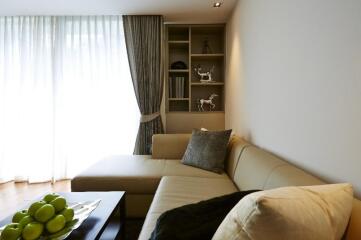 Cozy living room with beige sectional sofa