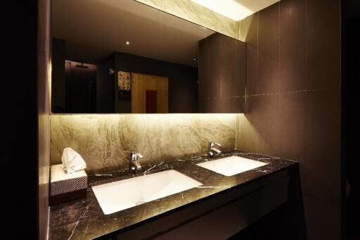 Modern bathroom with double sinks and ambient lighting