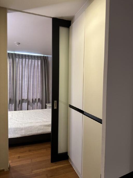 Bedroom with wardrobe and bed