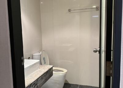 Modern bathroom with wall-mounted sink and toilet