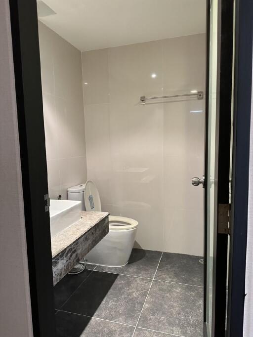 Modern bathroom with wall-mounted sink and toilet