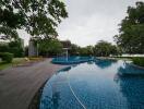 Serene outdoor pool area with lounging chairs