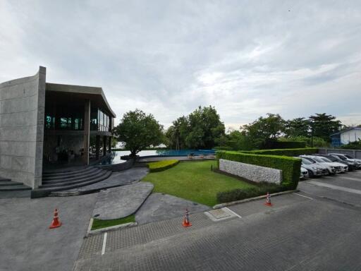 Modern building with garden and parking