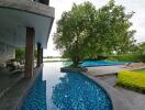 Outdoor area with swimming pool and lounge chairs