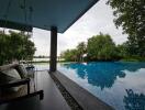 Outdoor view of a luxurious poolside with swing seating