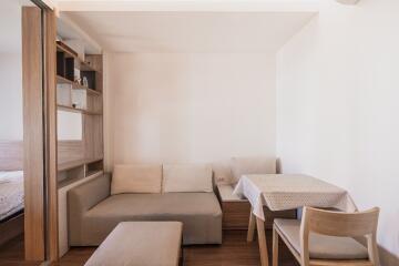 Bright and cozy living room with dining area