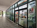 Convenience store entrance with glass windows and signs