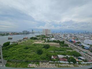 Panoramic city view with river and tall buildings