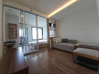 Modern living room with wooden floors and large glass doors