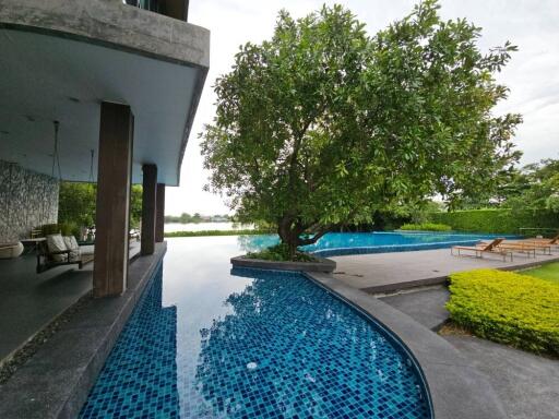 Outdoor area with pool and lounge chairs