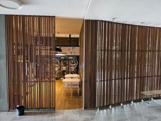 laundry room with wooden slat dividers