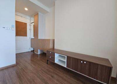 Modern living room with wooden floor and storage unit