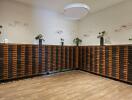 Mail room with wooden mailboxes and decorative plants