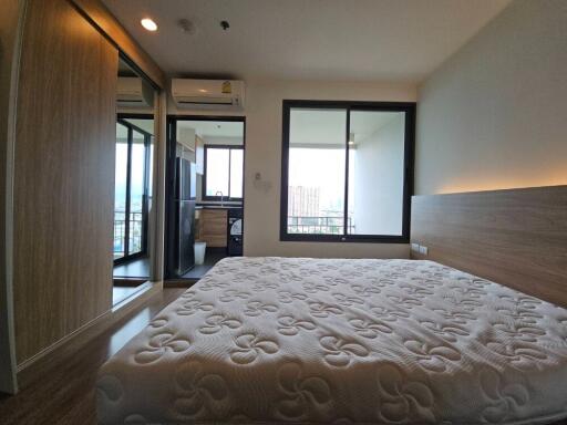 Bedroom with mattress, attached balcony and window view