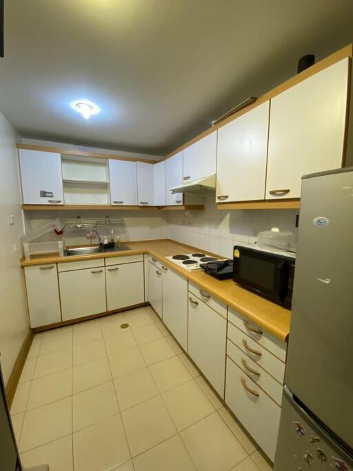 Modern kitchen with white cabinets and appliances