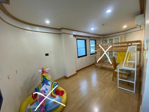 Well-lit bedroom with a loft bed, children