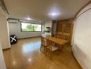 Dining room with wooden furniture and large window