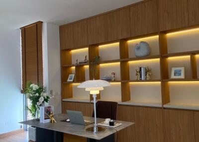 Modern office space with wooden shelves and a desk