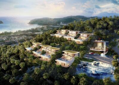 Aerial view of luxurious villas on a hillside with ocean view