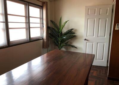 Bright office with large window and plant