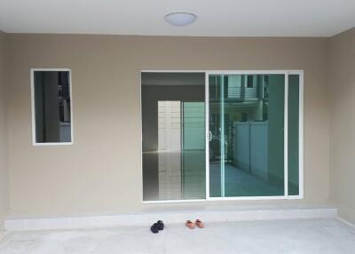 Outdoor covered area with sliding glass doors