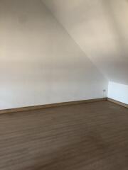 Empty Room with Sloped Ceiling