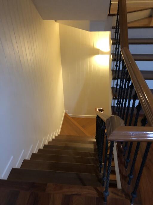 Staircase with wooden steps and handrail