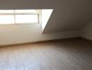 Spacious attic bedroom with skylight