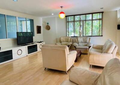 Spacious living room with modern furniture and large window