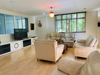 Spacious living room with modern furniture and large window