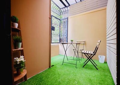 Cozy patio area with table and chairs