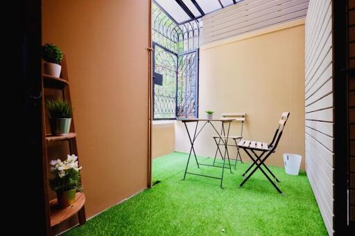 Cozy patio area with table and chairs