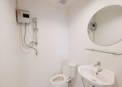 Clean white bathroom with modern fixtures