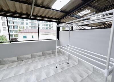 Modern balcony with a drying rack