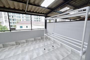 Modern balcony with a drying rack