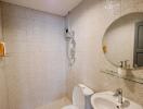 Modern bathroom with tiled walls, a toilet, and a sink