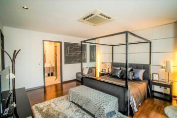 Spacious bedroom with modern decor and ensuite bathroom