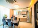 Modern kitchen with dining area and contemporary lighting