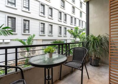 balcony with table and plants