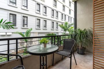 balcony with table and plants