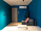 Bedroom with blue walls and air conditioner