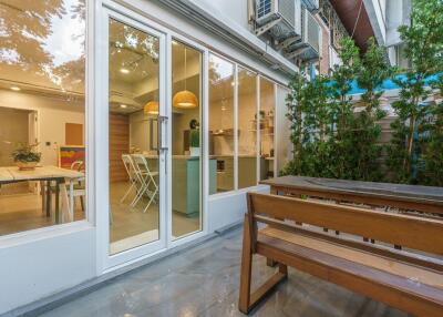 Patio area with view of indoor kitchen and dining space