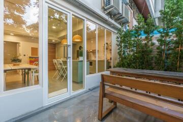 Patio area with view of indoor kitchen and dining space