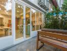 Patio area with view of indoor kitchen and dining space