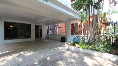 Covered garage with garden