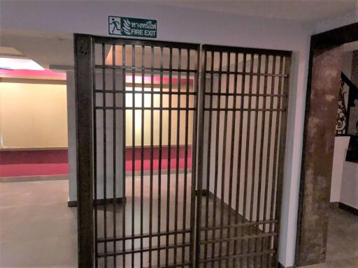 Entryway with fire exit sign and security bars