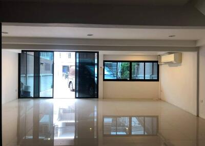 Living area with large windows and sliding glass doors