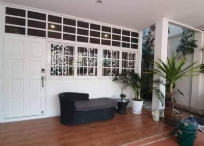 Front porch with plants and seating