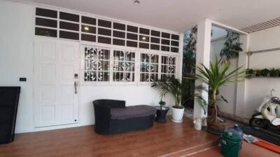 Front porch with plants and seating