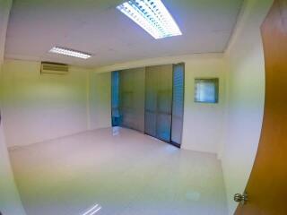 empty room with tiled floor and ceiling lights